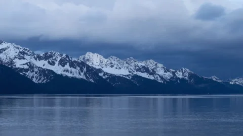 4K time lapse of Resurrection Bay snowy mountains in Seward, Alaska at sunset Stock Footage 243154149