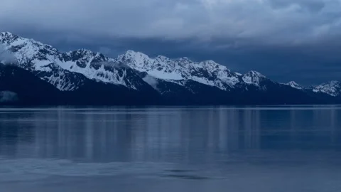 4K time lapse of Resurrection Bay snowy mountains in Seward, Alaska at blue hour Stock Footage 243155769