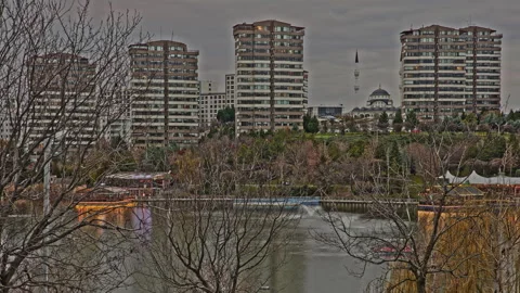 4K Time Lapse: Scenic City Lake with Fountains, Modern Apartments and Mosque. Stock Footage 323966920