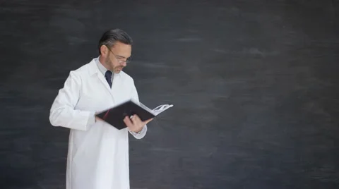 4K Time lapse scientist writing maths formulas on blackboard Stock Footage 67880973