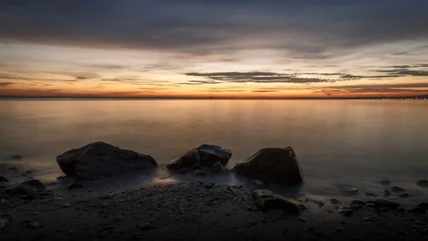 4K Time Lapse Sea Rocks Beach Clouds Dawn Dolly Stock Footage 71379540