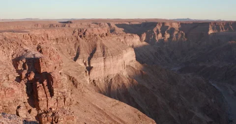 4K time lapse of shadow moving up the walls of Fish River Canyon Stock Footage 64698159