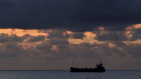 4K time lapse of a ship at anchor at dusk off the South Wales coast Stock Footage 319487514