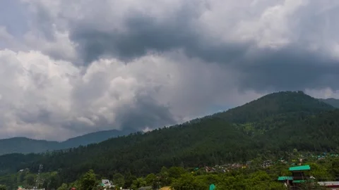 4K Time lapse shot of dark monsoon clouds above the Pine Tree forest Stock Footage 340183457