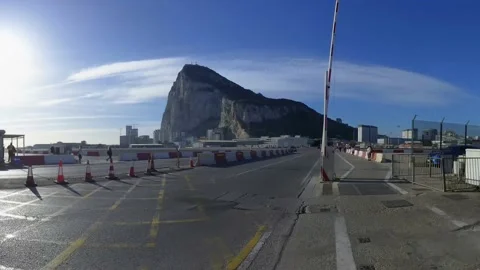 4K Time-Lapse showing traffic into Gibraltar crossing the runway of it's airport Stock Footage 237182587