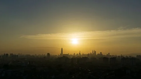 4K Time lapse of silhouette  sunset over downtown Kuala Lumpur, Malaysia. Zoom Stock Footage 94507907