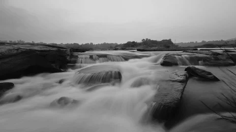 4K time lapse of a small waterfall in the middle of river Stock Footage 99532598