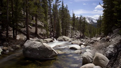 4K time lapse of smooth river water and a snowy peak in Yosemite National Park Video stock 145911100