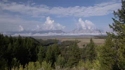 4K Time lapse of The Snake River and clouds around Grand Teton mountains Stock Footage 213379450