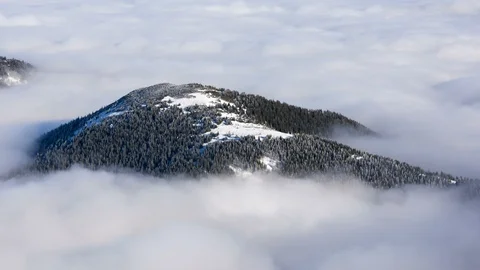 4K Time Lapse Of Snow Covered Hill In The Middle Of Cloud Inversion Stock Footage 121358965