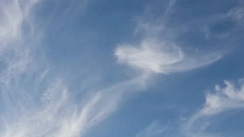 4k time lapse of soft white clouds moving on blue sky background Stock Footage 133534296