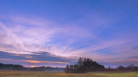 4k time lapse with spring meadow under morning sky. Stock Footage 155594067
