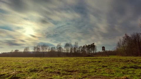 4k time lapse with spring meadow under cloudy sky. Stock Footage 155594124