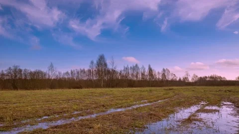 4k time lapse with spring meadow under cloudy sky. Stock Footage 155754331