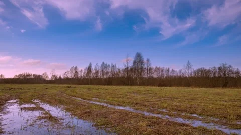 4k time lapse with spring meadow under cloudy sky. Stock Footage 253638114