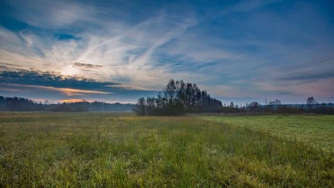 4k time-lapse of spring or autumnal polish meadow at sunrise Stock Footage 82250687
