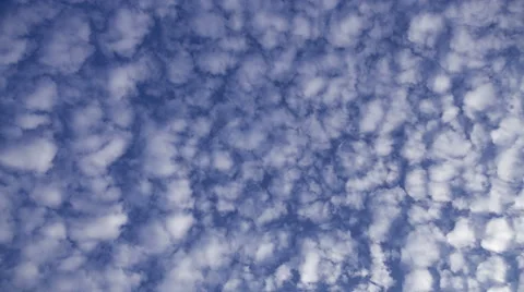 4k time lapse of stratocumulus clouds against blue sky Stock Footage