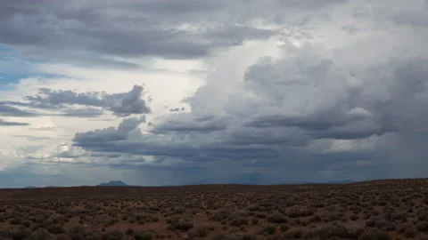 4K Time lapse of summer rain clouds over open desert and the San Francisco Peaks Stock Footage 158460036