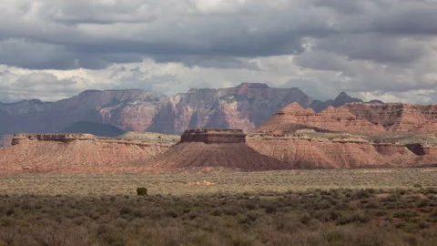 4K time lapse of summer rain cloud shadows on a distant Zion National Park Stock Footage 212477914