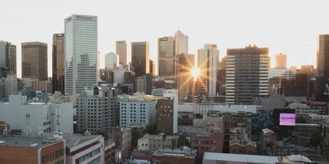 A 4k time lapse of the sun going down behind Melbourne's buildings Stock Footage 102292232