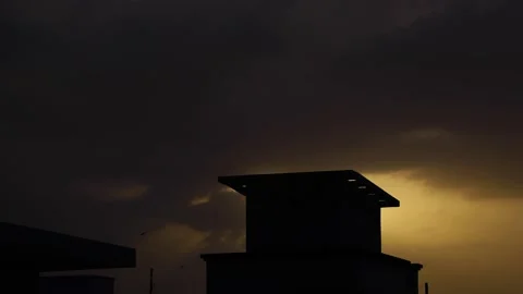 4k time lapse of the sun over the building with dramatic clouds. Stock Footage 150651774