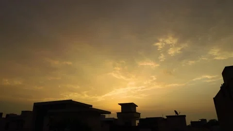 4k time lapse of the sun over the building with dramatic clouds. Stock Footage 150653274