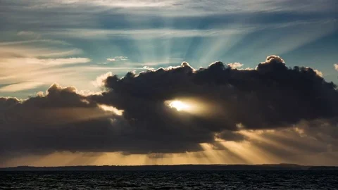4k time lapse sunbeams and clouds at sunset on the North Wales coast Stock Footage