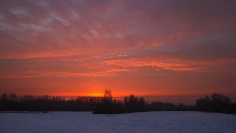 (4k) Time-lapse sunrise over winter snowy meadow in Poland Stock Footage
