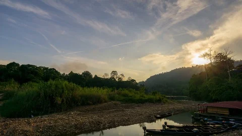 4K Time lapse sunrise over Kuala Tahan jetty - a gateway to Taman Negara. Stock Footage 105299892