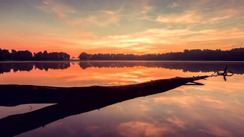 4k time lapse with sunrise over calm lake. Foggy morning. Stock Footage 154367709
