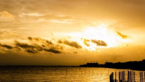 4K Time lapse sunset and beautiful fluffy storm cloudy yellow gold sky Video stock 93878706