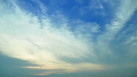 4K Time lapse sunset and beautiful fluffy cloudy blue and yellow sky  Stock Footage 106820396