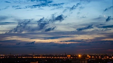 4K Time lapse sunset and cloudy blue and yellow sky smoothly flowing Stock Footage 107400267