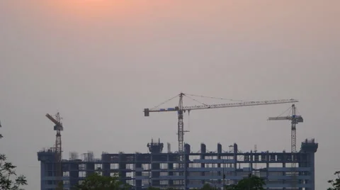 4k Time-lapse of Sunset Building construction with Crane at construction site Stock Footage 61800124