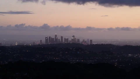 4K Time lapse of sunset clouds in a pink dusk sky and downtown Los Angeles 스톡 동영상 230497902