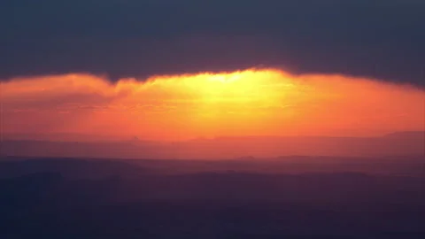 4K Time lapse of the sunset obscured by clouds above the desert in Canyonlands Stock Footage 149948442