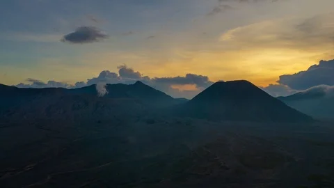 4K Time lapse of sunset over landscape of active volcano crater with smoke Stock Footage 88934906