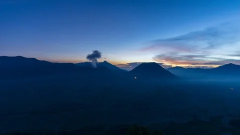 4K Time lapse of sunset over landscape of active volcano crater with smoke Stock Footage 88988032