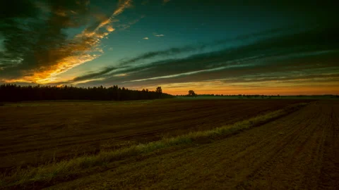 4k time lapse with sunset on plowed field. Stock Footage 244515352