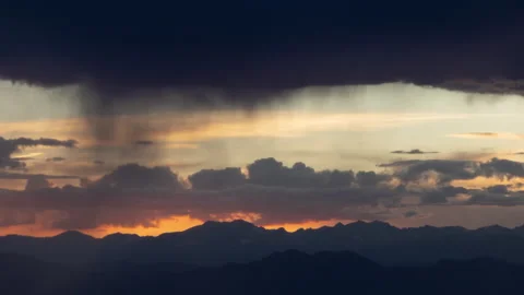 4K time lapse of sunset summer virga rain over the Rocky Mountains Front Range Stock Footage 201618051