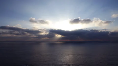 4K Time Lapse of Sunshine through Heavenly Clouds over Ocean -Tilt Down- Vídeos de archivo 48827934