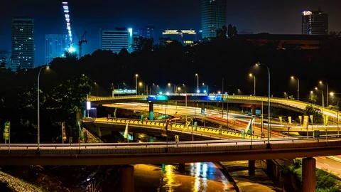 4K Time-lapse of traffic on freeway interchange at night in Kuala Lumpur Stock Footage 93880661