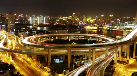 4k-Time lapse of traffic lights trail &amp; vehicles on overpass bridge at night. Stock Footage 33816017