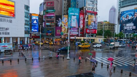 4k Time-lapse of Traffic on road with falling rain in Ximen district, Taipei, Ta Stock Footage 124732756