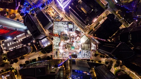 4K time-lapse of under construction site, crane, and car traffic transportation Stock Footage 124928623