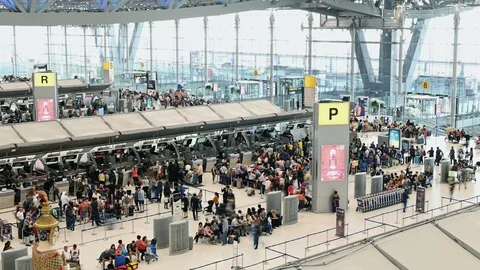 4K Time lapse of unidentified passengers at check in counter hall Stock Footage 101413433