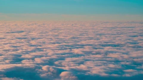 4K time-lapse of vast endless sea of clouds slowly flowing under blue sky Stock Footage 332932417