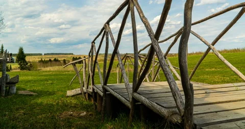 4k time lapse video. Beautiful rural landscape, camera movement, wooden bridge Stock Footage 130920464
