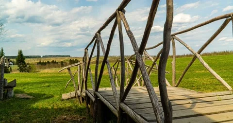 4k time lapse video. Beautiful rural landscape, camera movement, wooden bridge Stock Footage 136672875