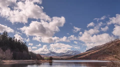 4K time lapse video of clouds over Llyn Mymbyr, North Wales Stock Footage 235347725